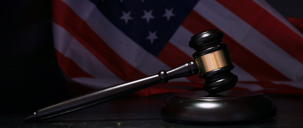 Judge gavel with American flag background