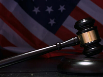 Judge gavel with American flag background