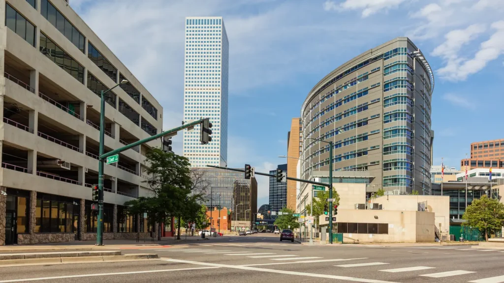 Street corner with Republic Plaza  (left) and Wellington Webb Municipal Office Building (right) in downtown Denver at Colfax Ave and Court .