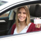 woman shows her drivers license